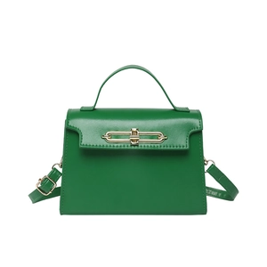 Elegant dark green trapezoid handbag with gold hardware and versatile crossbody strap