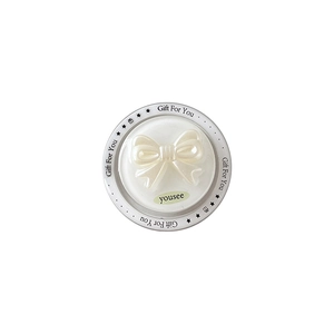 Pearly cream bow magnetic phone socket with shiny resin finish on a minimalist gift card