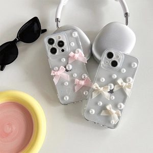Coque iPhone transparente scintillante avec perles et nœuds roses, design chic