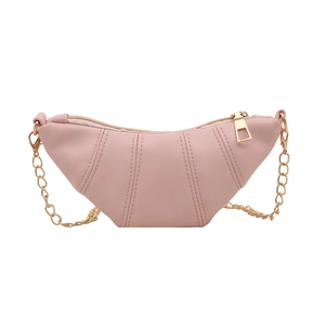Pink crescent crossbody bag with vertical stitching and gold chain shoulder strap