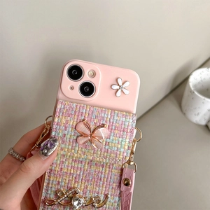 Detail of pink iPhone case with floral butterfly card holder and detachable strap
