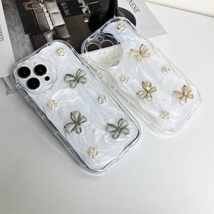 Pearlescent iPhone case with 3D butterflies and golden roses on a stylish magazine background