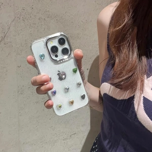 Glittery iPhone case with colorful 3D heart rhinestones on pearlescent white back