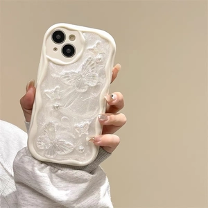 White pearlescent iPhone case featuring 3D butterfly decorations and pearl accents