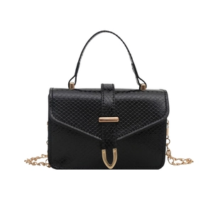 Glossy black snakeskin embossed crossbody bag with gold hardware and top handle