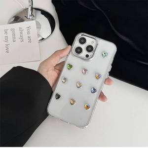 Handheld iPhone case featuring colorful heart-shaped rhinestones on clear glitter background