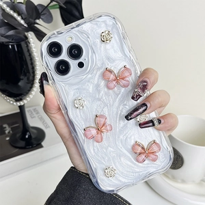 Detail of iPhone case with 3D pink butterflies and silver roses on pearl texture