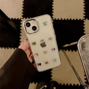 Detailed macro shot of 3D colorful butterfly decorations on a glittery iPhone case
