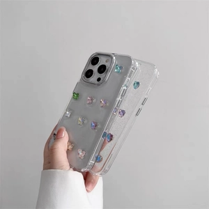 Detail of transparent iPhone case with colorful 3D butterflies and glitter finish