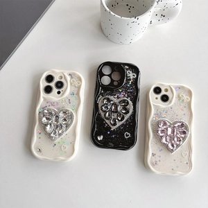 Shockproof iPhone case with large glitter heart rhinestones and cream wavy edge design