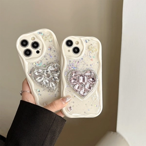 Creamy wave-edge iPhone case with sparkling sequins and a large rhinestone heart decor