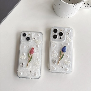 Coque iPhone marbre blanc avec tulipes 3D, perles et strass pour 16 Pro et 17