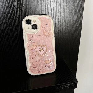 Detailansicht des cremefarbenen Wellenrahmens und der rosa Glitzerrückseite mit Perlenherz