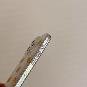 Side view of clear iPhone case featuring 3D gold turtle and precision side button cutouts