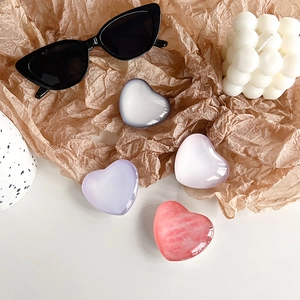 Gradient crystal heart phone socket grip set in pastel colors on minimalist background
