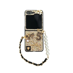 Golden glitter folding phone case with pearl strap, rhinestone 5 and metallic bow detail