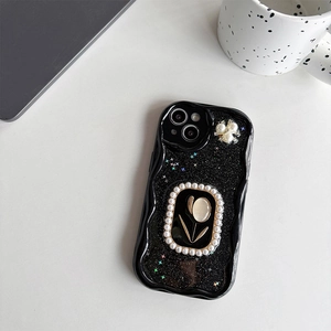 Detail of black wave edge phone case with glitter, gold tulip relief and pearl accents