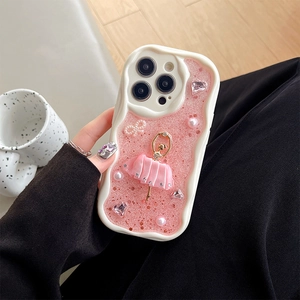 Detail of pink glitter phone case with ballet dancer figure, pearls and rhinestones
