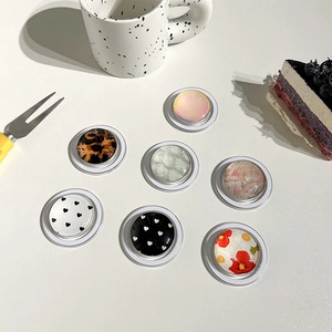 Collage of chic round phone sockets with diverse patterns like leopard and floral prints