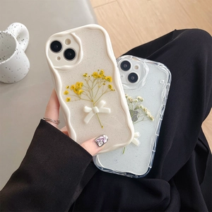 Glitter iPhone case with 3D white bow and yellow dried flowers on cream wavy frame