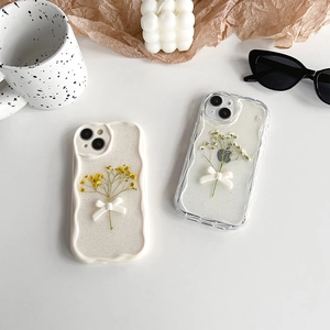 Floral iPhone case with bow decoration and real dried flowers on white wavy frame