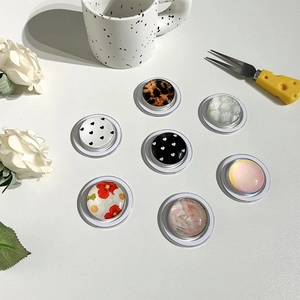 Set of 7 stylish crystal dome phone sockets with floral, heart, and marble patterns
