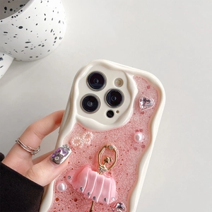 Detail of pink glitter iPhone case with ballet girl, pearls, and rhinestones décor