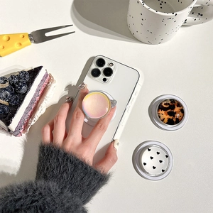 Phone grip set featuring iridescent, leopard, and polka dot designs on a white case