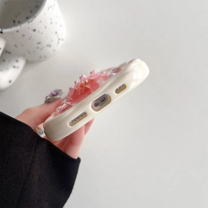 Detailed view of precise speaker and charging port cutouts on a 3D floral iPhone case