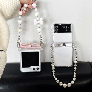 Transparent Samsung Galaxy Z Flip case with pearl strap and decorative bow design
