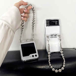 Transparent Galaxy Z Flip6 case with silver bear charm and stylish bead hand chain strap