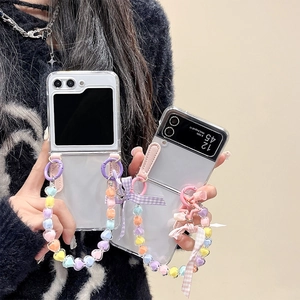Clear Samsung Galaxy Z Flip case with heart beads and colorful bow strap charm