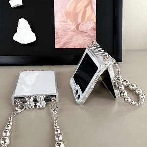 Detail view of transparent Z Flip case with silver bear charm and chunky metal bead chain