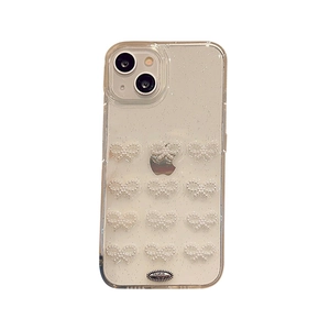 Glittery transparent iPhone case with white 3D pearl bows and metallic detail