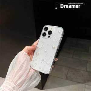 Detail of glitter phone case with 3D pearl bow and heart charms for iPhone series