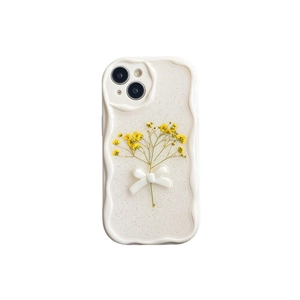 Glittery transparent iPhone case with yellow flowers and 3D bow on wavy cream frame