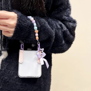 Clear case for Samsung Z Flip 6 with colorful heart beads and a pink leather strap