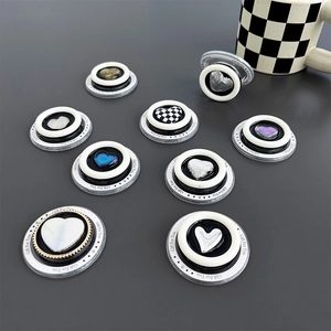 Macro shot of assorted MagSafe heart phone grips with iridescent and checkered finishes