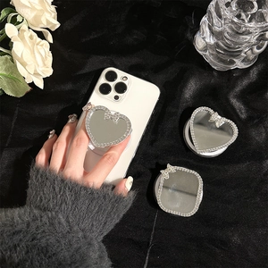 Magnetic diamond-encrusted mirror phone grip with heart shape and bowknot detail
