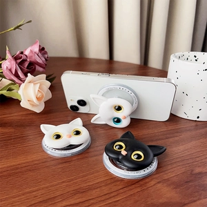 Detail of cute cat shaped phone grip with dual color eyes and transparent round base