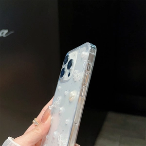 Detail of iPhone case with silver foil glitter, 3D pearls and delicate bow accents