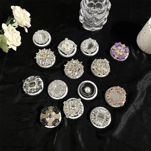 Luxury MagSafe phone grip collection with pearls and rhinestones on black velvet