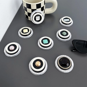 Macro shot of stylish gemstone and pearl pop sockets with 'Gift For You' engraving