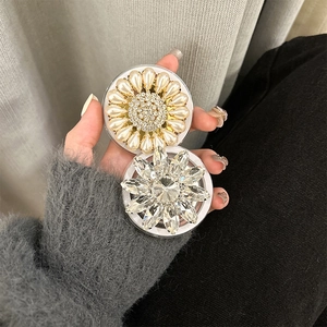 Detailed view of sunflower phone sockets with crystals and pearls on MagSafe mount