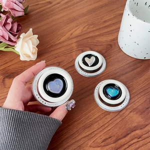 Close-up of MagSafe heart phone grips in gradient colors with Gift For You engraving