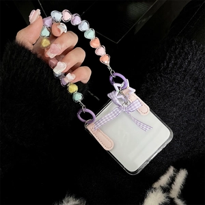 Detail of clear Z Flip phone case with colorful heart beads and purple plaid bow
