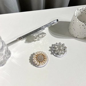 Luxury rhinestone and pearl floral MagSafe phone socket stand with high-end mirror finish