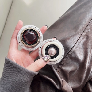 Detail of gemstone and pearl phone grip holders with decorative Gift For You text