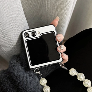 Detail of Z Flip case featuring white leather texture and ice-crack bead handle strap