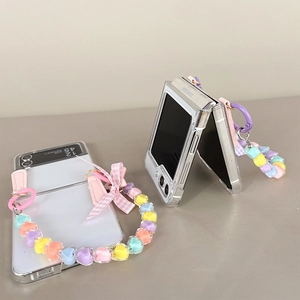 Detailed view of clear Samsung Galaxy Z Flip 6 case with colorful heart beads and bow lanyard